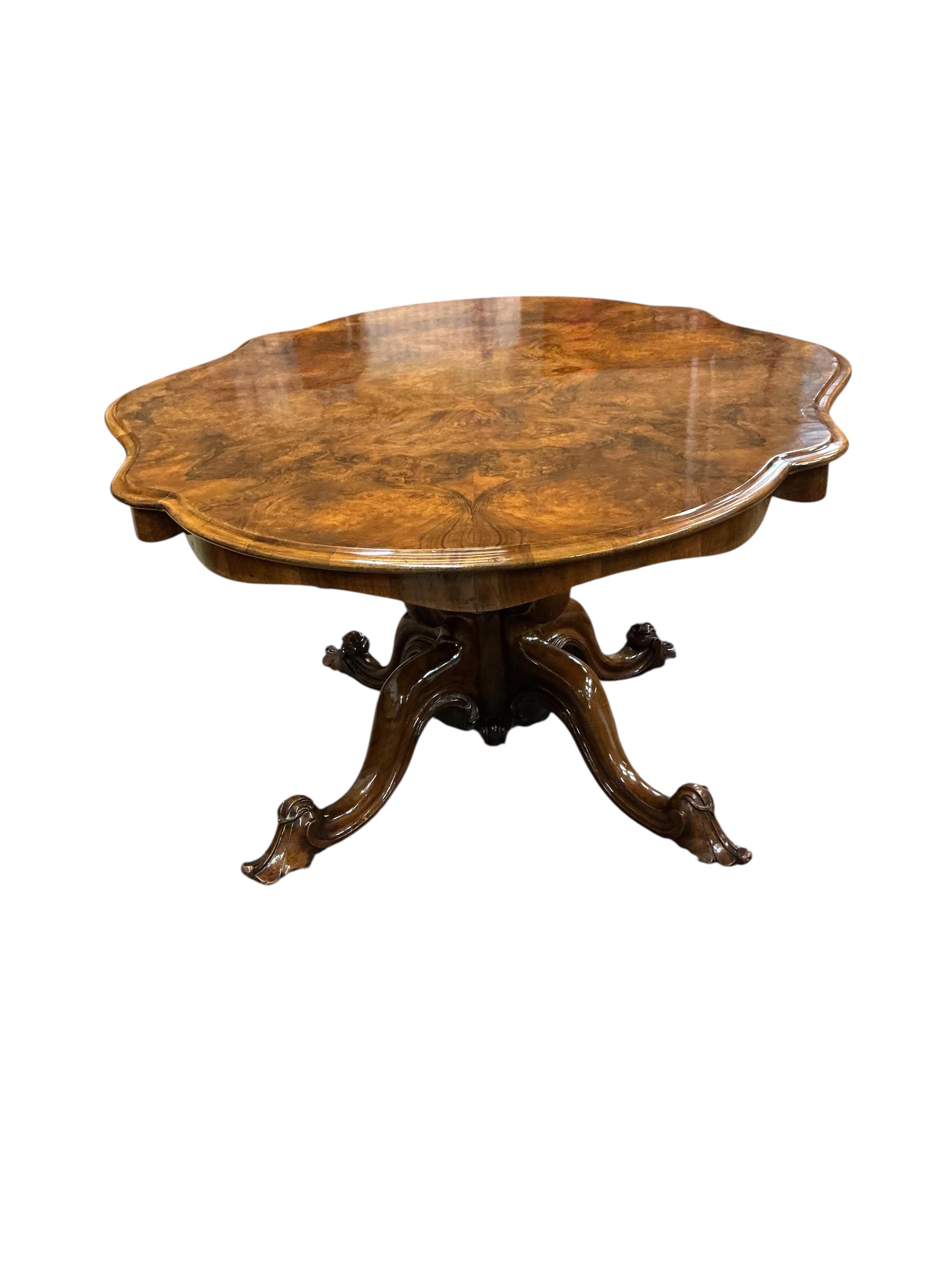 A Victorian oval burr walnut tilt top loo table, width 114cm, depth 146cm, height 74cm